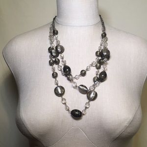 Multi strand clear earth beaded necklace